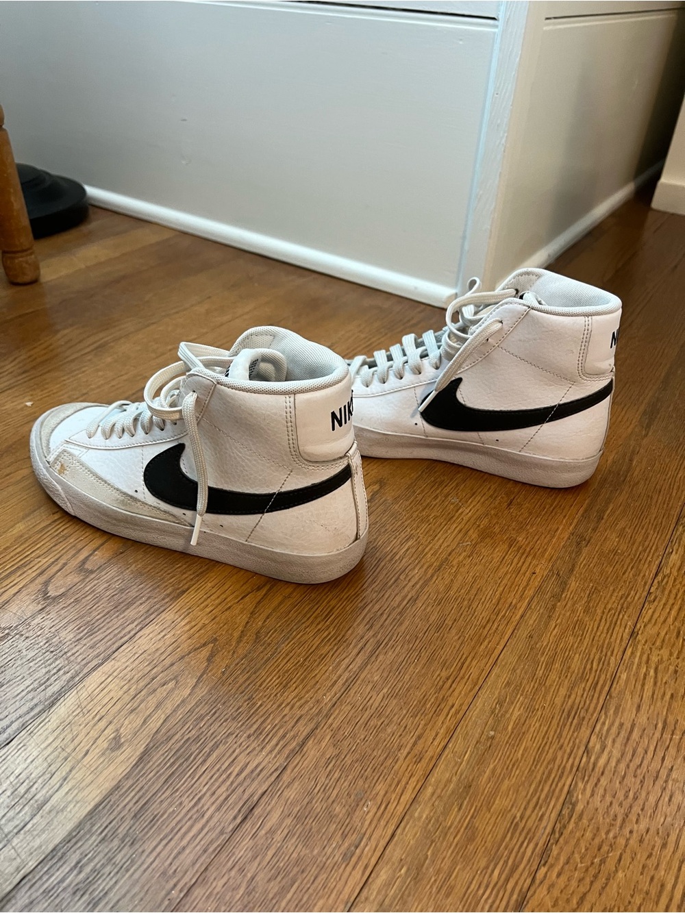 Nike Women’s White High-Top Sneakers with Black Swoosh
